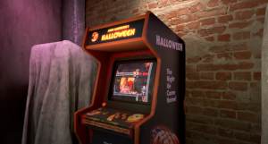 frame grab of the RetroRealms announcement trailer showing an upright arcade cabinet holding an adaptation of Halloween, the 1978 slasher classic